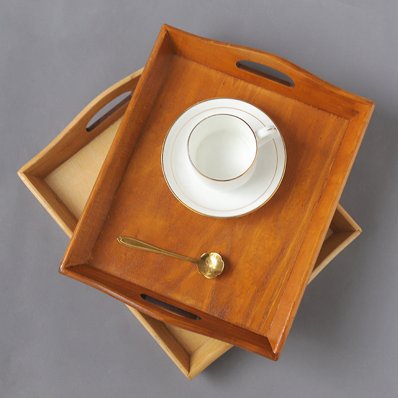 Natural rectangular wooden serving tray with raised edges