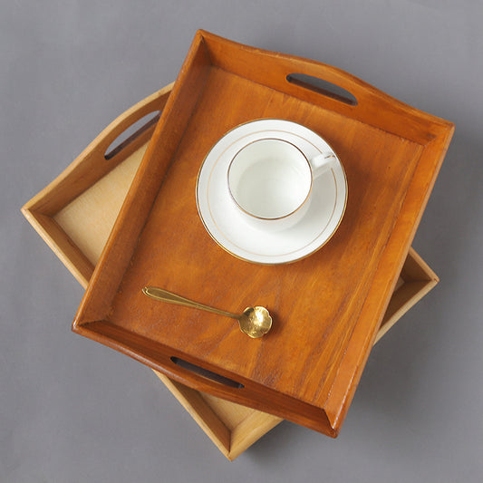 Natural rectangular wooden serving tray with raised edges