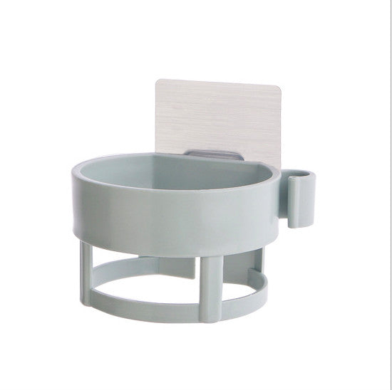 Adhesive hair dryer organiser mounted beside a bathroom vanity