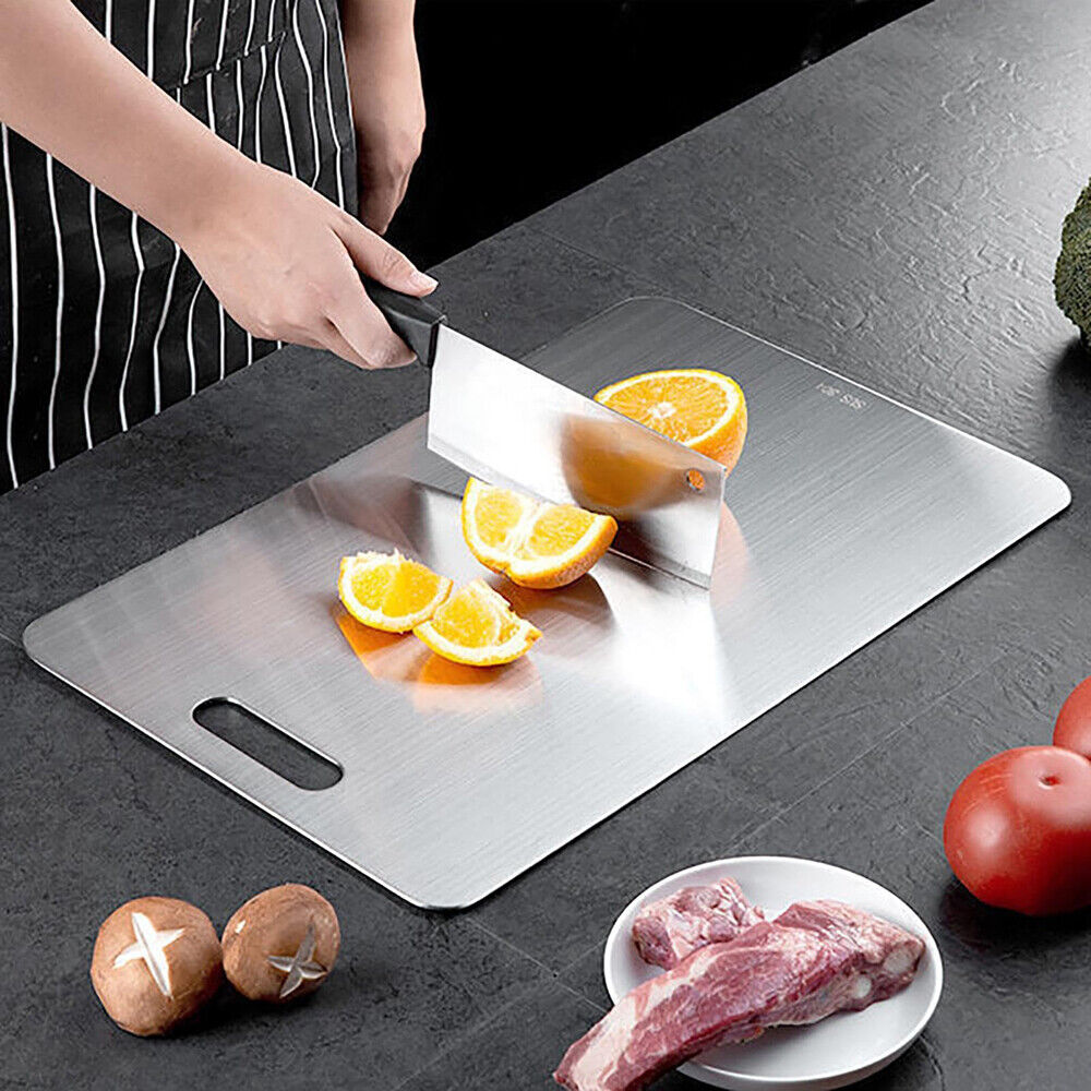 Reversible stainless steel cutting board for food preparation
