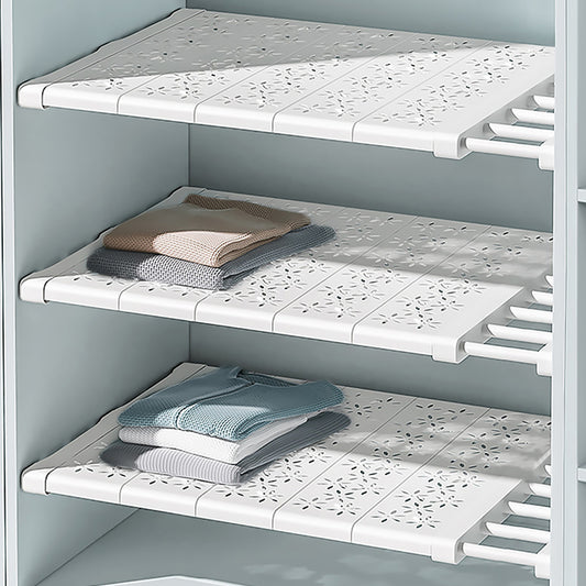 Adjustable shelf divider creating extra cabinet storage space