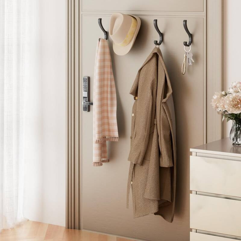Wall-mounted hooks for hallway coats and backpacks